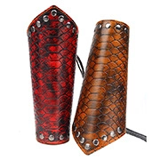 Detail of red and brown scale texture leather armguards with metal studs and lace-up design