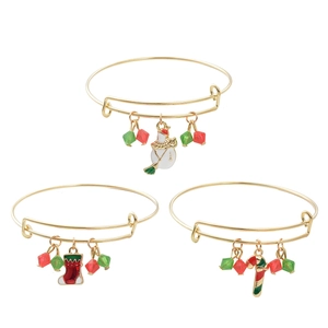 Three-piece gold Christmas bangle set with snowman, stocking and candy cane charms