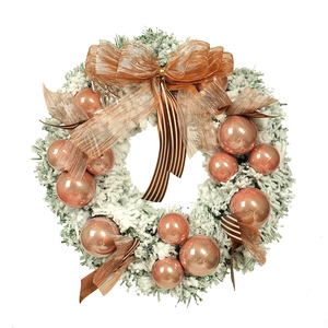Rose gold Christmas wreath with white flocking snow effect and bronze baubles