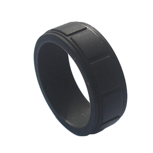 Men's black silicone sports ring with industrial groove pattern on a white background