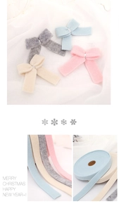 Detail showing colorful wool felt ribbons and DIY bows for Christmas tree decoration