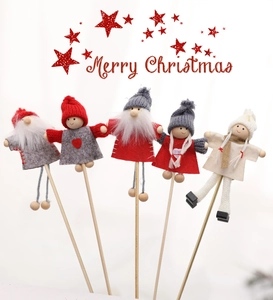 Detail view of 5 mini Christmas gnome plant stakes with felt hats and wooden sticks