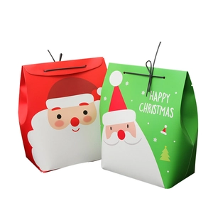 Red and green Christmas gift boxes with cartoon Santa Claus and Happy Christmas text