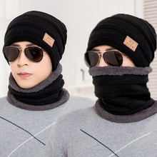 Detail of men's winter knit beanie and neck warmer set with soft gray fleece lining