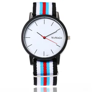 Close-up of minimalist white dial and colorful nylon striped strap on a quartz watch