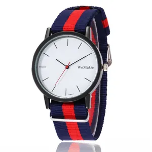 Detail of the blue and red striped nylon NATO strap with metal buckle and black watch case