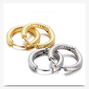 Detailed close-up of 3mm knurled stainless steel hoop earrings in gold and silver