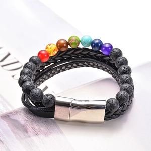 Detail of multi-layer leather bracelet with lava stones and colorful chakra beads