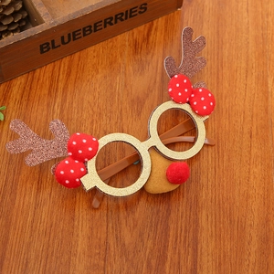 Festive Christmas antler glasses frame with glitter and bow on a rustic wooden table