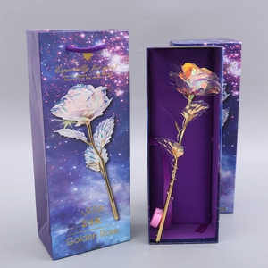Detailed view of a 24k gold foil rose with holographic petals in a starry gift box