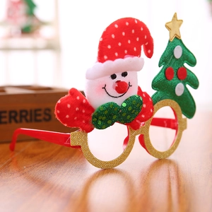 Detail of Christmas glasses featuring a snowman and tree with festive glitter accents