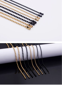 Detail of gold and black titanium steel ball bead chains with secure metal connectors