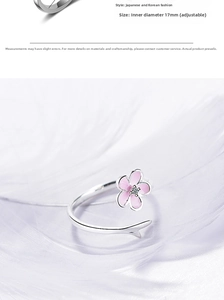 Detail view of pink cherry blossom ring with adjustable 17mm inner diameter band