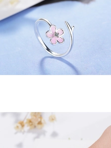 Detailed close-up of S925 sterling silver hallmark on floral open ring with pink flower