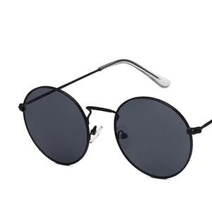 Classic retro round metal sunglasses with black frames and dark lenses on white background
