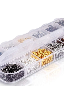 Transparent organizer box with multi-colored metal jump rings for DIY jewelry making