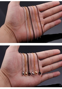 Detail showing gold, silver, and black stainless steel necklaces with lobster clasps