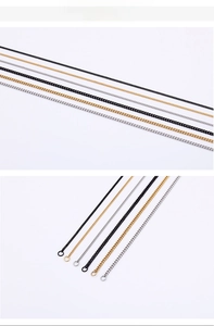 Detail showing high-quality stainless steel jewelry chains in black, gold, and silver finishes