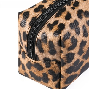 Close-up of leopard print makeup bag featuring textured leather and durable zipper