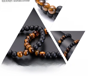 Detail of 8mm tiger eye and matte black beaded bracelet for couples showing high quality