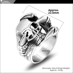 Detailed macro view of retro stainless steel skull ring with dragon claw elements