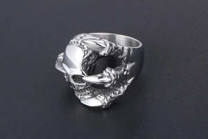 Detailed view of silver gothic punk skull and claw ring made of vintage stainless steel