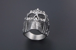 Close-up of a men's punk skull ring in durable titanium steel with intricate textures