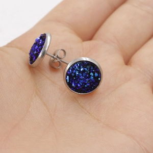 Blue 10mm druzy stud earrings in stainless steel base held in palm for size scale