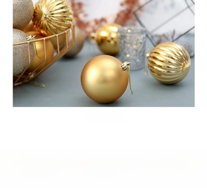 Detail of luxury gold Christmas ornaments with matte and glitter finishes in a wire basket