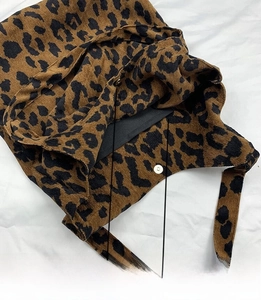 Detailed view of leopard print corduroy tote showing magnetic closure and inner pocket