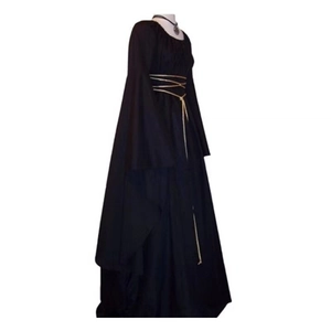 Detail view of black gothic witch dress with flare sleeves and golden belt decoration