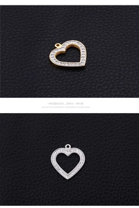 Macro view of gold and silver hollow heart pendants with sparkling rhinestone inlay