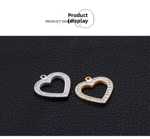 Detail of sterling silver heart pendants with sparkling pavé stones in gold and silver