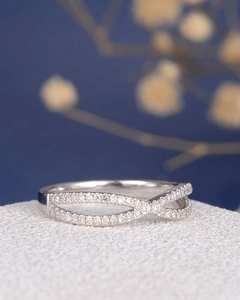 Elegant crisscross infinity ring with sparkling pavé cubic zirconia in silver finish