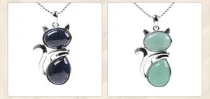 Detail of cat pendants with blue sandstone and green aventurine on silver chains