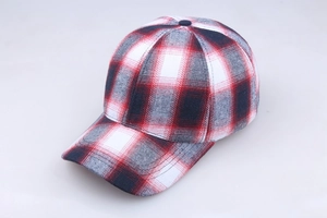 Detailed top-down view of the red and black plaid cotton baseball cap structure