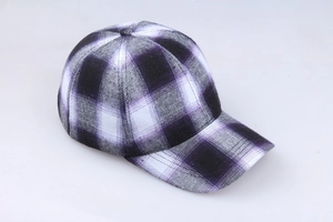 Detail of purple tartan cotton baseball cap showing woven fabric texture and plaid pattern