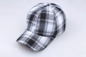 Detailed view of the black and white checkered pattern and curved brim of the cotton baseball cap