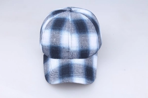Top-down view showing blue, grey and white plaid pattern on a cotton baseball cap