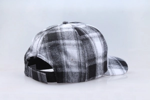 Detailed back view of black and white checkered baseball cap showing adjustable strap buckle