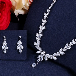 Elegant silver alloy jewelry set with marquise zircons and floral motifs on blue velvet