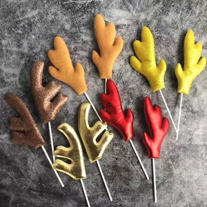 Glitter reindeer antlers cake toppers in multiple colors displayed on a grey background