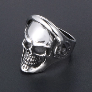 Silver punk skull ring for men with headphone details on a black matte background