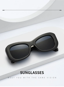 Detail shot of black thick-frame sunglasses featuring elegant bamboo-style temples
