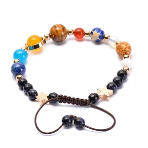 Solar system planet bracelet with natural stones and adjustable braided cord on white background
