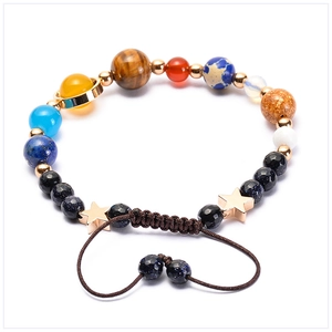 Detail of solar system planets bracelet with natural stones and adjustable braided rope