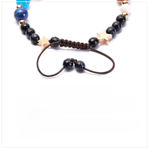 Detail of high-quality brown woven rope with adjustable knot for planetary stone bracelet