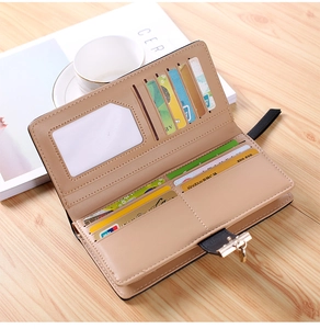 Detailed interior of a beige long wallet featuring multiple card slots and metal clasp