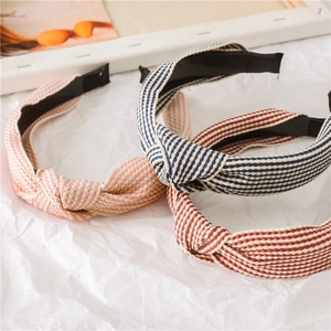 Three striped knot headbands in pink, blue, and red cotton fabric for women