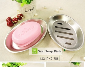 Oval stainless steel soap dish with drainage slots measuring 14x10x2.7cm for bathroom